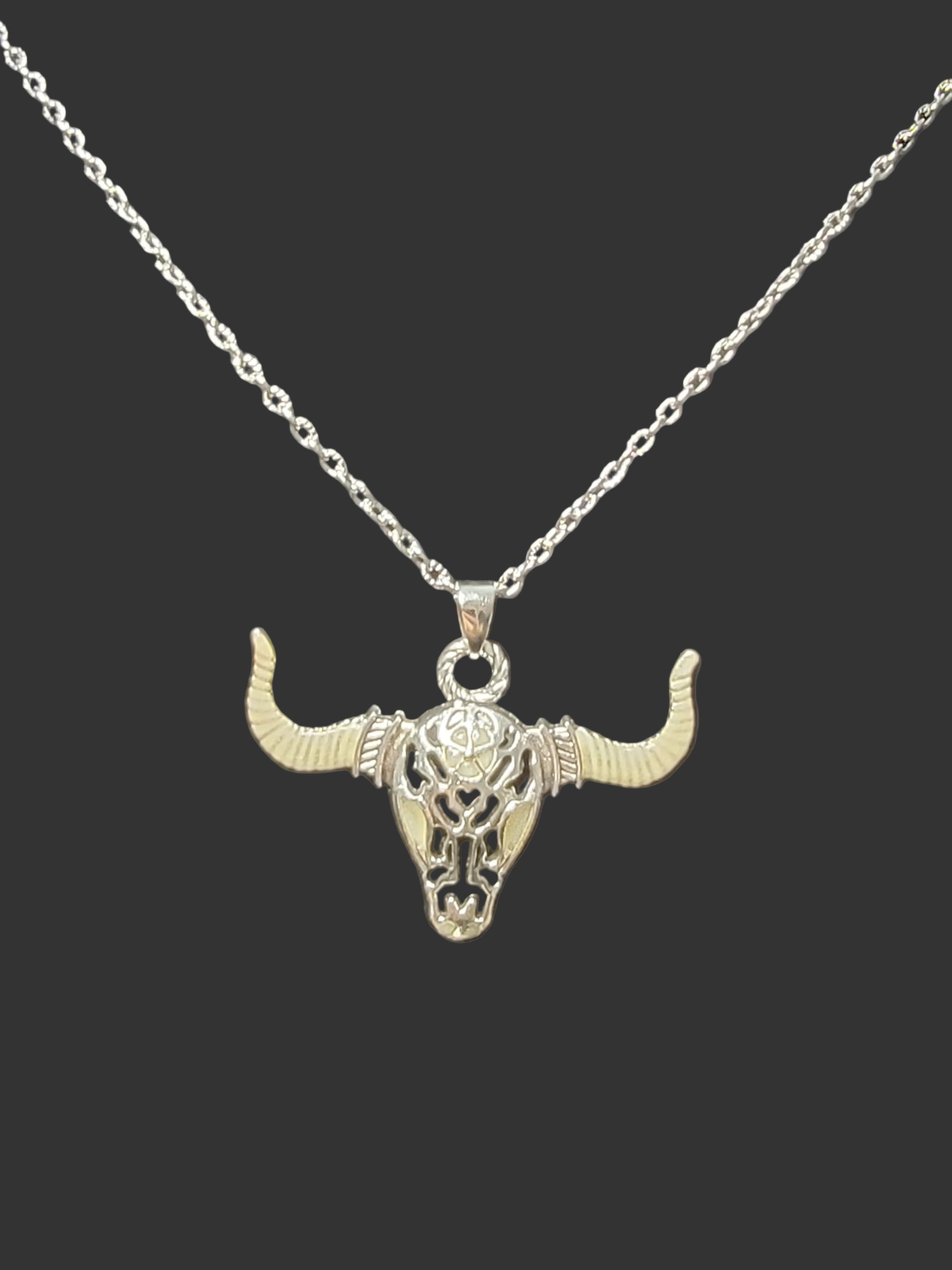 Fearless buffalo skull glow-in-the-dark silver pendant necklace symbolizing strength and perseverance