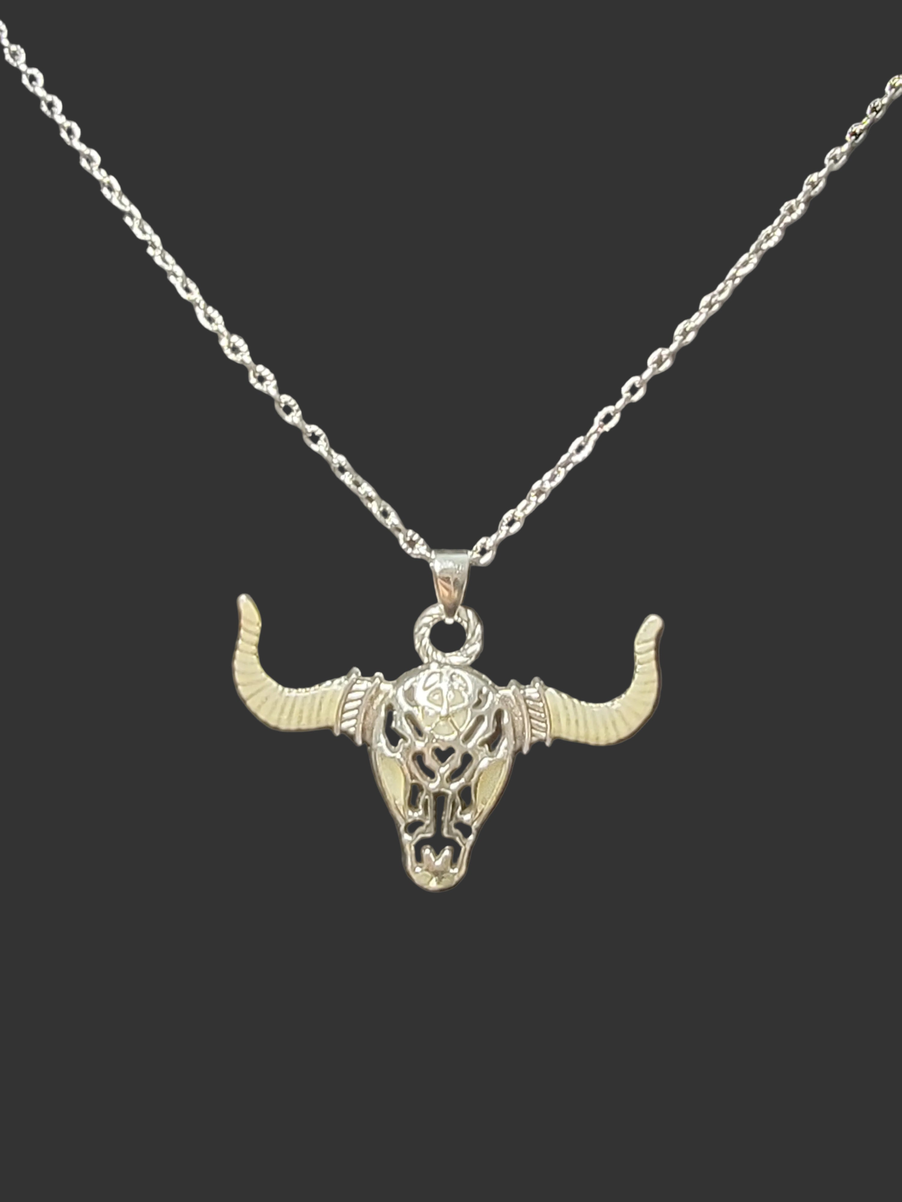 Fearless buffalo skull glow-in-the-dark silver pendant necklace symbolizing strength and perseverance