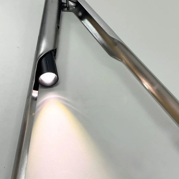 Close-up of integrated LED lights illuminating food while grilling with GRILLIGHT tools